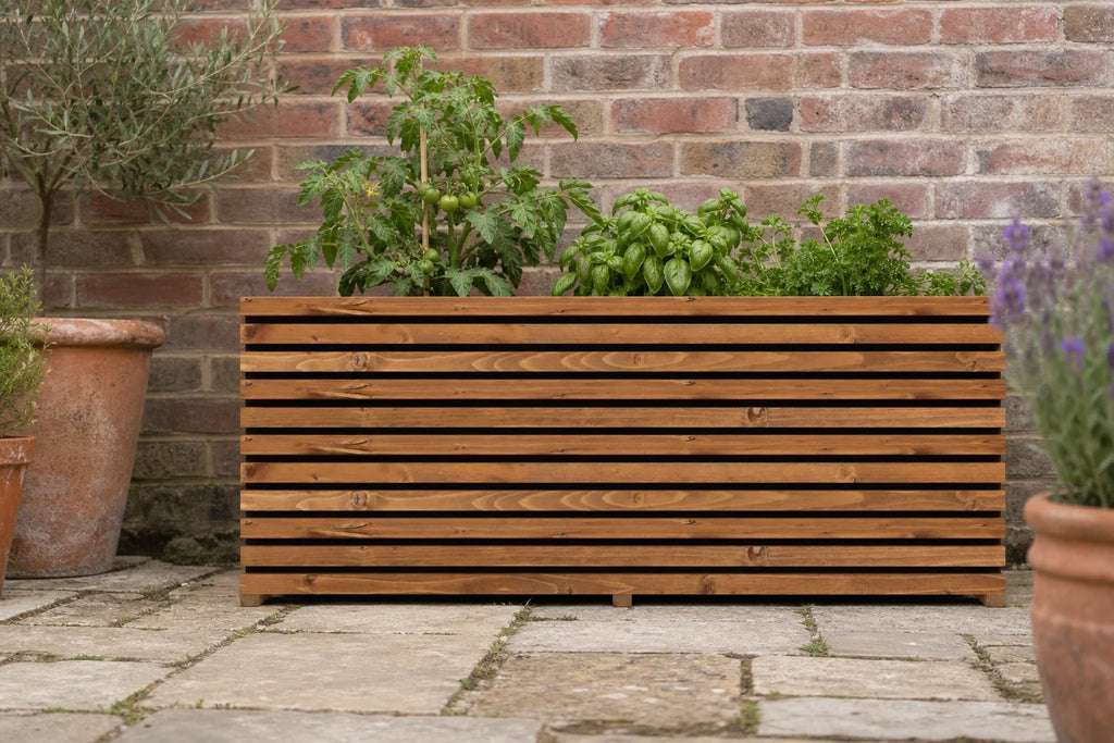 Fitted tan Sussex planter height extension with tomatoes and herbs in a British patio garden.
